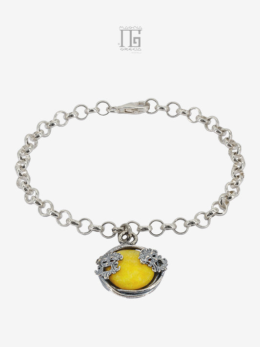 Bracciale Aion in argento 925 con pietra gialla, filo intrecciato e maschere apotropaiche.